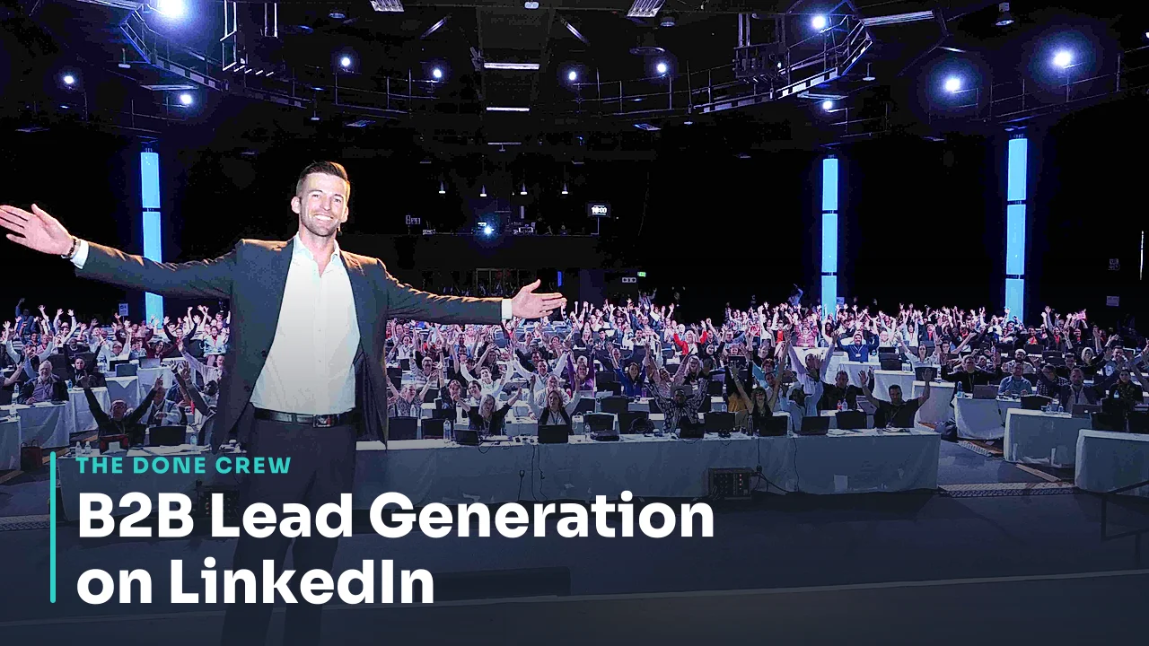 Matt Clark on stage with arms wide in front of a packed audience at a live event